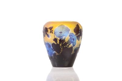 a vase that is sitting on a table with a white base