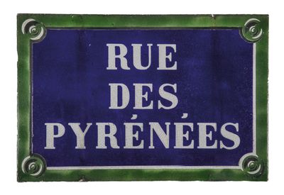 blue and white sign with french words on it saying rue des pyrenes