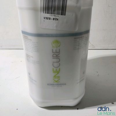 a white container with a label on it sitting on a table