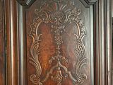 an image of a wooden door with carvings on it