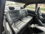 two seats in the back of a car that are black