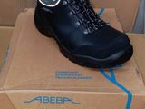 a box with a pair of black shoes on it
