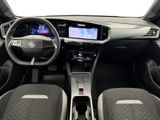 the interior of a car with a steering wheel, dashboard, and dashboard controls