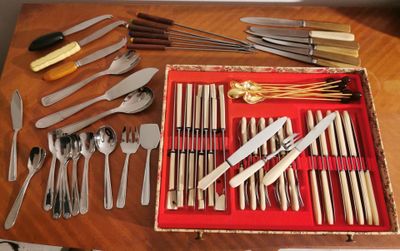 many different types of silverware on the table