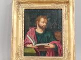 une image représentant un tableau de Jésus en train de lire un livre, dans un cadre doré