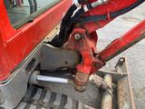a close up of the front end of a red truck