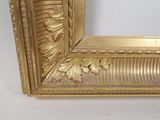 a picture of a picture of a gold frame on the wall