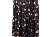 the skirt is black and has a floral pattern on it