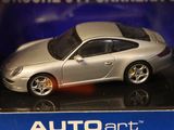 a silver toy car on display in a display case