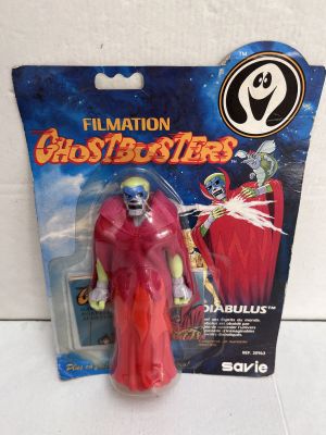 a close up of a toy figure in a package on a table