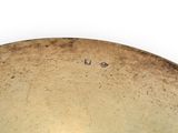 a large metal bowl sitting on a white surface