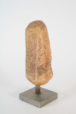 statue of a head on a stand with a white background