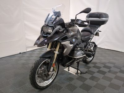 a motorcycle that is parked in a room with a checkered floor