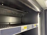a metal shelf in the middle of a room