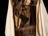 an image of a statue of a woman wearing a robe and holding a book