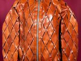 an orange leather jacket on a mannequin mannequin mannequin mannequin mannequin mannequin mannequin mannequin manne