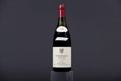 a bottle of wine sitting on top of a glass table