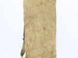 beige canvas bag with a handle and a strap