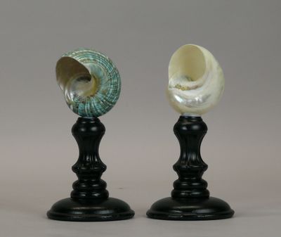 two vases sitting on top of each other on a table