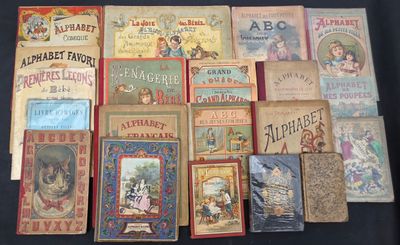 many old children ' s books on display on a table