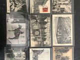 a lot of old black and white photos on a table