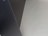 a black metal shelf with a hole in the middle of it