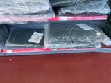 many bags of clothing on the shelf in the store
