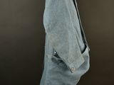 an image of a blue jacket on a mannequin stand