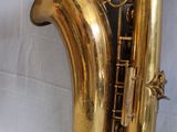 a gold saxophone that is sitting on a table