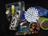 many pens and pencils in a container on the table