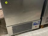 a stainless steel dishwasher sitting on the floor