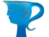 a blue glass cup with a face on it