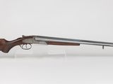 a rifle with a wooden barrel and a wooden handle