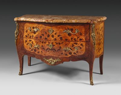 an antique chest of drawers with a marble top