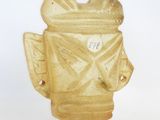 a small statue of a fire hydrant on a white surface