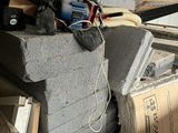 a pile of construction materials sitting on top of a pile of bricks