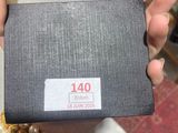 a person holding a box with a price tag on it