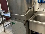 two sinks and a sink in a small kitchen