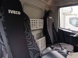two seats in the back of a truck that is parked