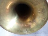 a close up view of a brass trumpet on a table