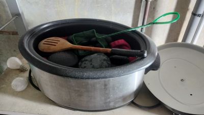 pots and pans are sitting on a counter in a kitchen