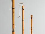 three flutes are lined up in a row on a table