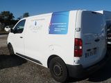 a white van that is parked in a parking lot