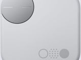 an image of a close up of a button on a white device