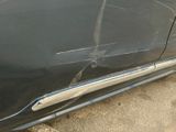 a close up of a car door handle with a sticker on it