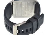the watch is black with a silver face and a black rubber band