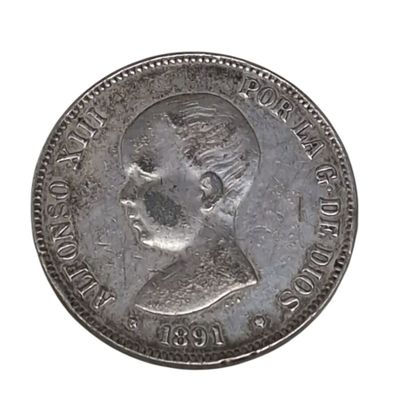 a close up of a coin on a white surface with a white background