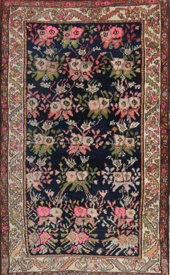 an antique persian rug with a floral design