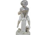 statue of a woman with a basket of flowers on a pedestal