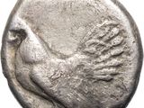 an old silver coin with a bird on it
